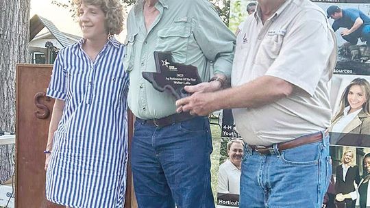 WCFB President Bob Avant presents the Williamson County Farm Bureau Agricultural Business Person of the Year award to Walter Lalla and an unidentified friend. Source: Stiles Farm Foundation