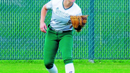 Camryn Nunamaker running to get under a ball to secure an out. Photo by Larry Pelchat