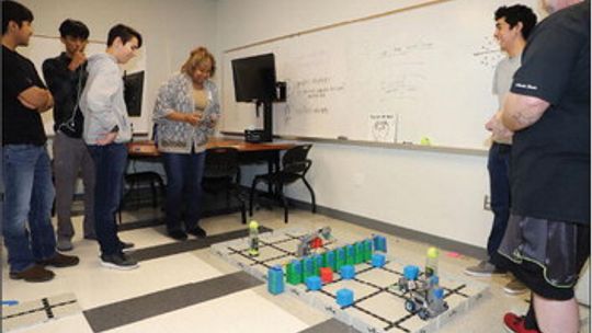 Rhonda Russell and Trent Hazelwood from Gemini enjoy a fun lesson in robotics from students at Legacy Early College High School. Gemini has supported the robotics program through generous donations to the Taylor Educational Enrichment (TEE) Foundation, and students and staff invited them t...