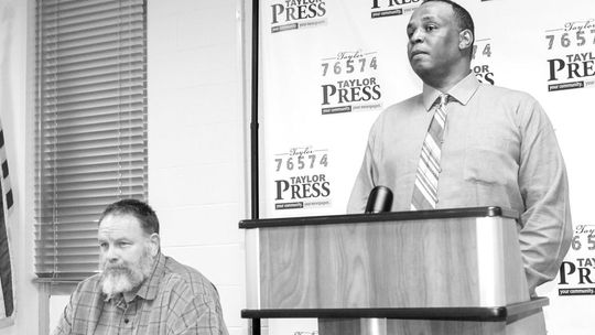 Incumbent Gerald Anderson answers a question after his opponent Stan Werner finishes speaking at the candidate forum April 12. Photo by Fernando Castro