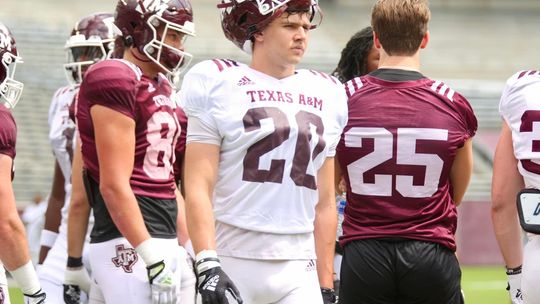 Johnny Ryder watching the drill, waiting his turn while living his dream in an Aggie uniform. 