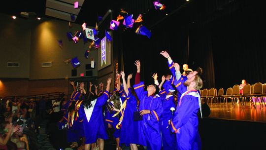 Granger High School students toss their caps in the air in celebration for their Class of 2023 Commencement Ceremony Saturday, May 27, at Taylor ISD Event Center. Photos by Grace Horvath