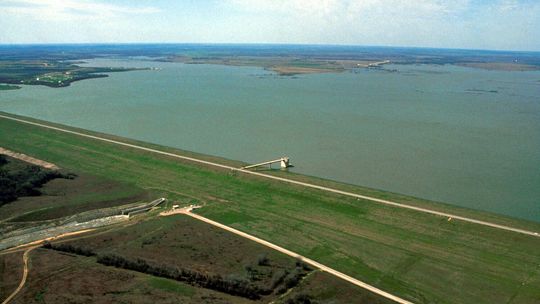 Pictured is an aerial view of Granger Lake and Dam on the San Gabriel River in Williamson County. The dam is located approximately 10 miles north-northwest of Taylor. The U.S. Army Corps of Engineers constructed the dam in 1980 for flood control and water supply. This view is toward the so...