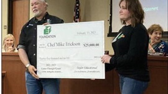 At the Feb. 20 Meeting of the Taylor Independent School District Board of Trustees, Taylor High School Culinary Arts Program instructor Chef Mike Erickson was presented with a check for $25,000 for a tailgate barbecue trailer from the Taylor Educational Enrichment Foundation. (From Left) E...