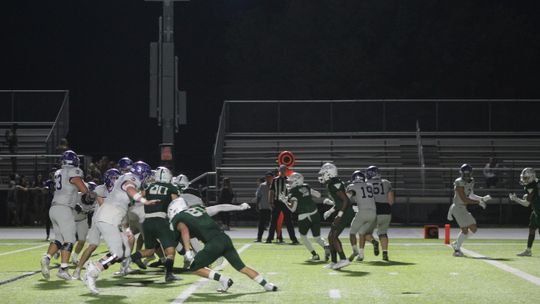 Ducks' defensive line fires off the ball looking to get past the Boerne offensive line to make a play. Photo by Evan Hale