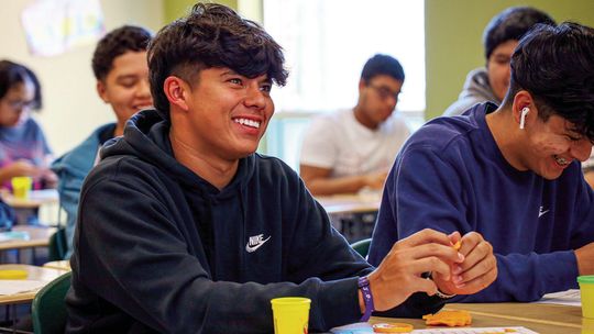 Ayden Gutierrez smiles big in Sarah Stresing’s geometry class at Taylor High School during a hands-on lesson using play-doh. Students used the familiar childhood toy to construct various lines and shapes. Photo by Ryan Newsom