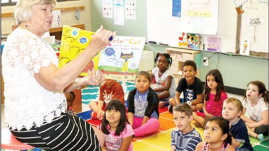 Barbara Leschber reads to elementary class as a volunteer for the Williamson County Retired Teachers Association. She taught at Taylor High School for 43 years before retiring in 2015. Photos courtesy of Tim Crow
