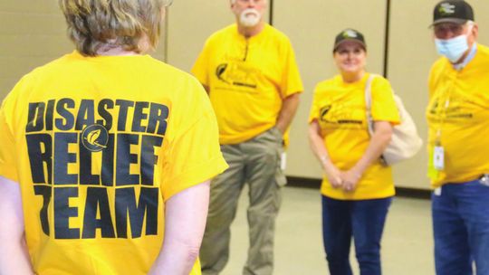 ADRN volunteers have a brief meeting and discuss how to help serve the needs of residents who have been impacted by last week’s storms.