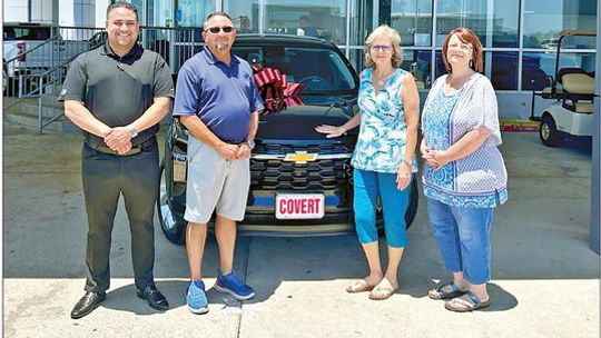 Lorenzo Beltran from Covert Hutto stands with new car winner Sammy Ybarra, Melissa Ybarra and Donna Jones of Hutto Resource Center.