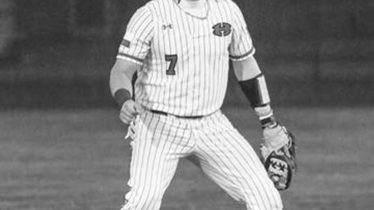 Garet Boehm getting into his defensive stance as the pitch is delivered. Photo By Larry Pelchat