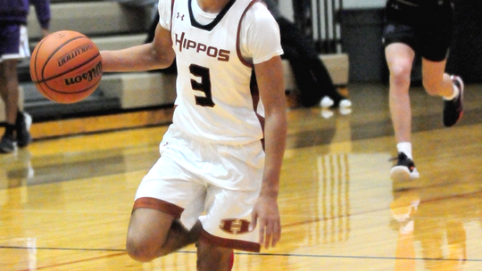 Hippos’ senior Jeremiah Washington speeding up the court on a fast break. Photo by Larry Pelchat