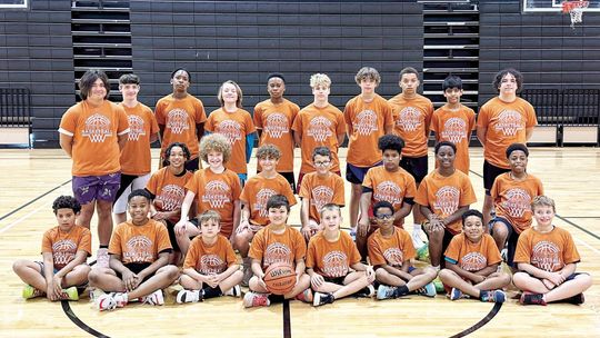 Hutto campers from grades three through nine happily gather around for a photo on June 8 following the annual Hippos boys basketball camp. Photo courtesy of Hutto ISD