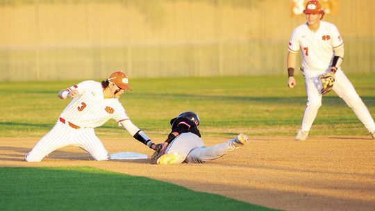 Levi Fletcher tagging a runner out at second to close out an inning for the Hippos. Photo by Larry Pelchat