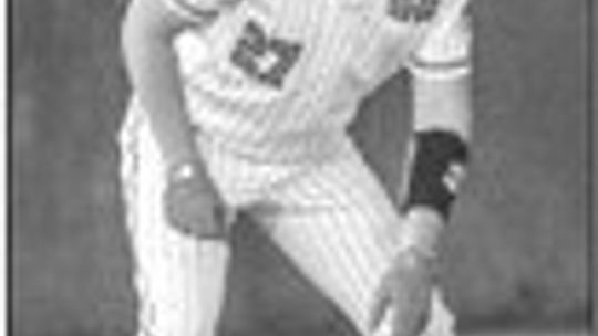 Carson Forrest taking a lead off of third base contemplating stealing home. Photo by Larry Pelchat