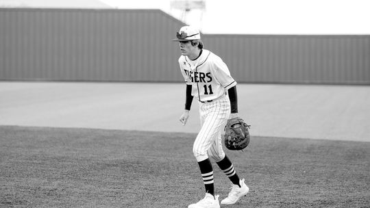 Carson Ball moving around to help his team make a defensive play as the ball is put in play. Photo by Larry Pelchat