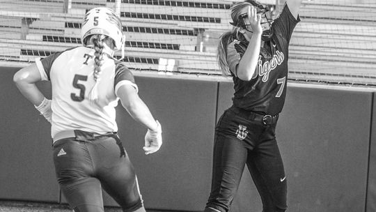 Camryn Nunamaker trots into home plate standing up for an easy point for the Lady Ducks. Photo By Larry Pelchat