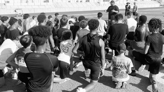 Lampe speaks to young Hippos football players on July 24 during the annual youth football camp held at Hutto Memorial Stadium. Photo courtesy of Will Compton