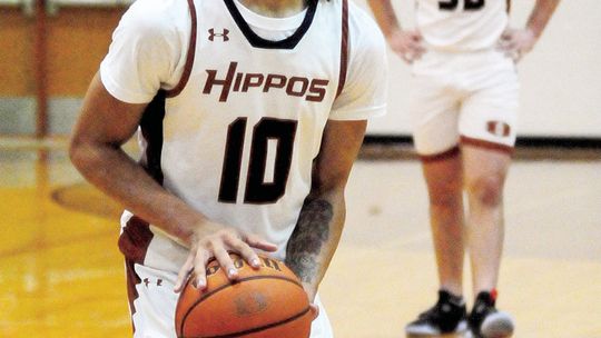 Dylon Richardson takes a moment to focus before shooting a free throw Photos by Larry Pelchat