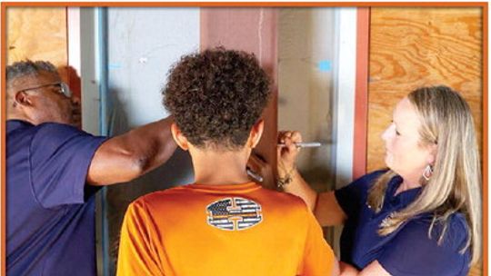 HUTTO SIGNS BEAM FOR SECOND HIGH SCHOOL