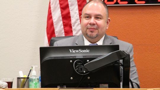 Hutto Independent School District Superintendent Raul Pena listens to a speaker at a previous school board meeting.