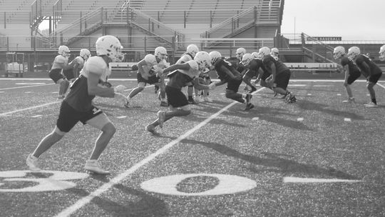 Ducks varsity football has its first day of practice in full pads and helmets on Aug. 6, 2022, at Taylor Stadium. Photos by Evan Hale