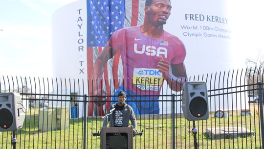 Earlier this year, Fred Kerley attended a ceremony unveiling a mural on the water tower on Main Street in Taylor. After the event, Kerley got back to work preparing for upcoming races. Photo by Jason Hennington