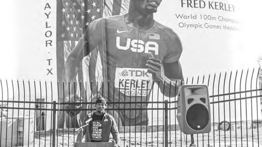 Taylor High School alumnus and Olympic medalist Fred Kerley speaks to the community on Feb. 4 at his mural dedication. Photo by Jason Hennington