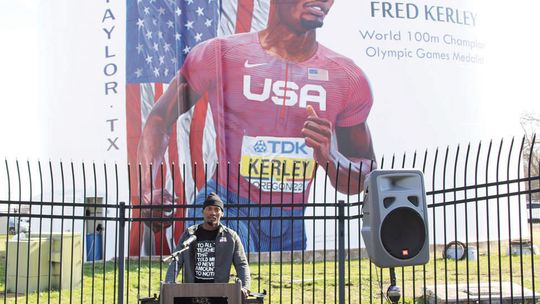 Earlier this year, Fred Kerley attended a ceremony unveiling a mural on the water tower on Main Street in Taylor. After the event, Kerley got back to work preparing for upcoming races. Photo by Jason Hennington