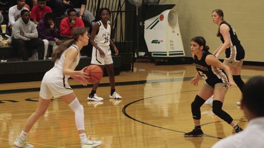 Lady Ducks sophomore and leading scorer Sophia Fisher makes a move to get past a Giddings Lady Buffalo defender on her way to the basket.