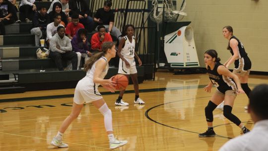 Lady Ducks sophomore and leading scorer Sophia Fisher making a move to get past a defender and drive to the basket. 