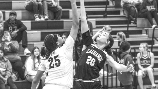 Kionayh Rivers battles for the opening tip off to start the game against La Grange. Photo By Evan Hale