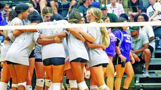 The Taylor High School varsity volleyball team huddles together on Saturday, Aug. 5 prior to the Lady Ducks’ home scrimmage against Killeen Chaparral High School. Photo by Andrew Salmi