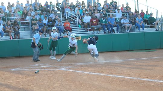 Lady Duck Mackenzie Watson eludes the Lady Buffs catcher during Taylor’s 10-0 stampeding win over Giddings last Thursday, April 28 at The Pond.