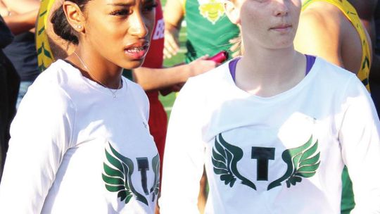 Lady Duck track speedsters Destiny Lewis and Emma Whitsel stand ready to go at the Riesel Indian Invitational last Thursday, March 17. Photo by Matt Hooks