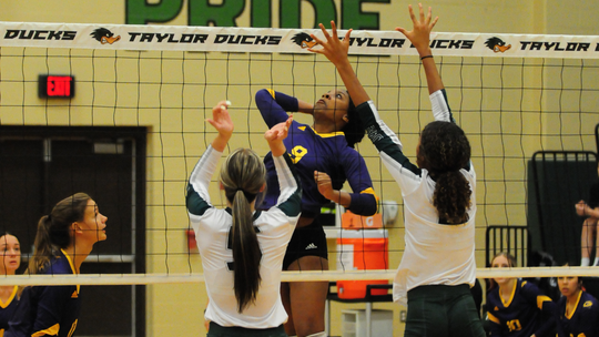 Lady Lions varsity volleyball senior Jaila Rollie gets a kill at the net during the Granger road match in Taylor