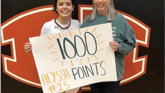 Alyssa Batton celebrates reaching 1,000 points in her basketball career Jan. 6 after a game against Glenn. Photo courtesy of the Hutto ISD Facebook page