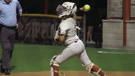 Lady Hippos sophomore catcher Riley Deroulac throwing out a runner at second base. Photo by Evan Hale