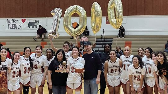 Lady Hippos junior Alyssa Batton posing with her teammates after the game to celebrate her 1,000th career point. Courtesy Photo Hutto ISD