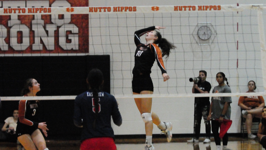 Hutto High School varsity volleyball junior Isabella Orton goes up to spike the ball on Aug. 29 during the Lady Hippos’ home match win over Georgetown East View High School. Photo by Larry Pelchat 