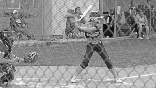 Lady Lions junior Montana Moore shifts her weight as she swings the bat looking to get on base against Holland. Photo by Evan Hale