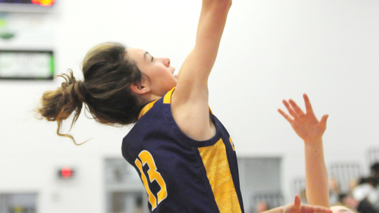 Lady Lions guard Montana Moore laying the ball up into the basket. Photo by Larry Pelchat