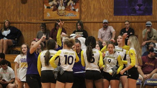 Granger Lady Lions break down their huddle before game against Holland. Photos by Evan Hale