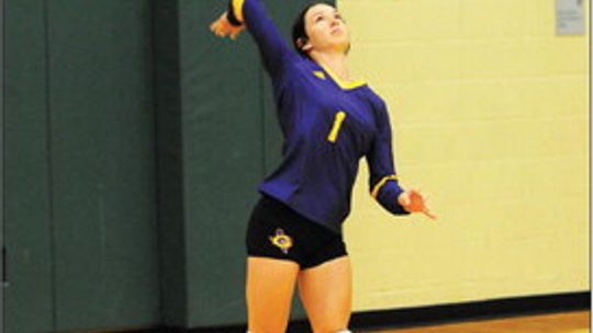 Granger High School varsity volleyball senior Montana Moore serves the ball on Aug. 22 during a Lady Lions’ road match against Taylor High School. Photo by Larry Pelchat