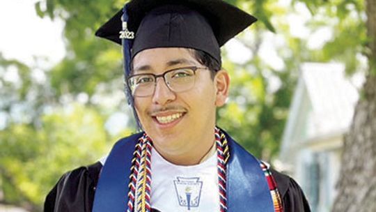 Alec poses during Legacy Early College High School’s May 19 graduation ceremony through which he received both his high school diploma and associate degree. Courtesy photo