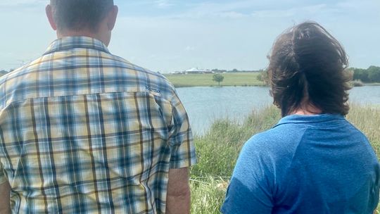 John and Renee Kitsmiller eye the Samsung plant from their backyard.   Photo by Suzanne Stevens 