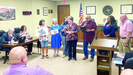 At Large Councilman Dwayne Ariola reads the mayor’s proclamation of September being “Library Card Sign-up Month” in the City of Taylor to Library Director Karen Ellis at the City Council meeting Aug. 25.