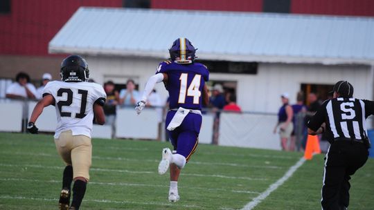 Granger High School varsity football senior wide receiver Trae Herrera runs down the sideline after a long reception Aug. 25 during the Lions' 57-8 blowout victory at home vs. Hubbard High School. Photo by Larry Pelchet.