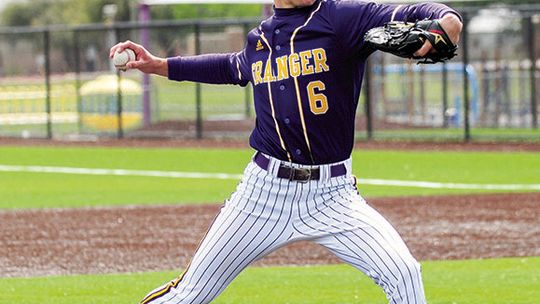 Lions senior Travis Burton delivering a strike to the Thrall batter. Photo by Larry Pelchat