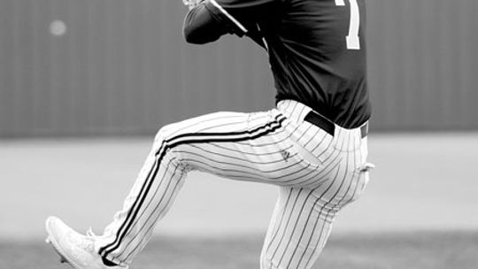 Lions’ senior pitcher Nate Tucker delivering a pitch during a game against Milano. Photo by Larry Pelchat