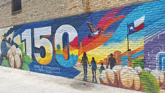 Local artist restores Taylor city mural after vandalism